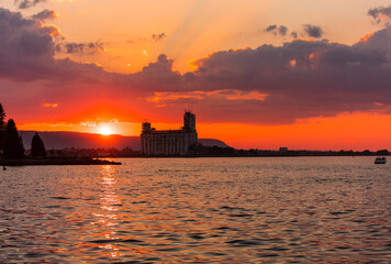 Sunset behind Collingwood Terminals and Blue Mountain and lake