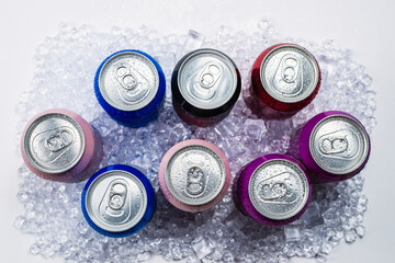 Group of aluminium cans in ice, cold drink.
