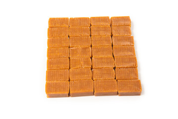 Tasty caramel candy isolated on white background.
