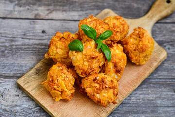 fried chicken popcorn from breast on wooden background
