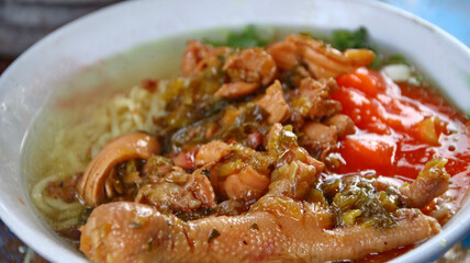 Indonesian food, mie ayam, noodles with chicken presented directly by the seller on the cart
