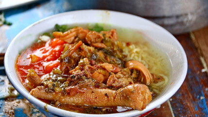Indonesian food, mie ayam, noodles with chicken presented directly by the seller on the cart