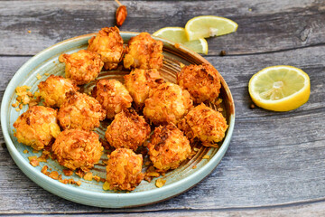 fried chicken  popcorn with sauce and fresh lemons 