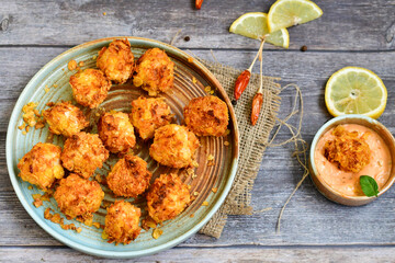  Home made Crispy Chicken   Popcorn with honey mustard sauce on wooden background