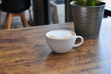 cup of coffee  on wooden table