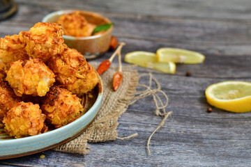  Home made Crispy Chicken   Popcorn with honey mustard sauce on wooden background