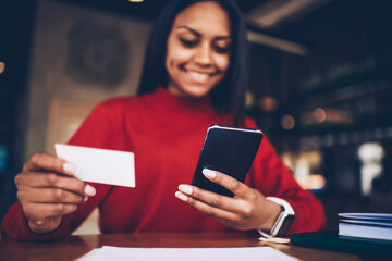 Cheerful afro american student happy getting visit card with phone number of entrepreneur searching job