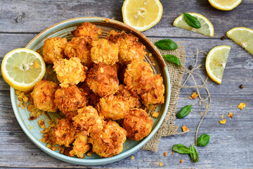  Home made Crispy Chicken   Popcorn with honey mustard sauce on wooden background