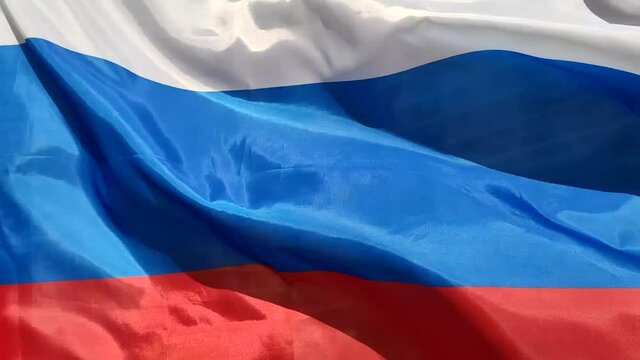 A full screen view of the flag of the Russian Federation fluttering in the wind