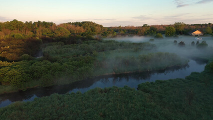 Aerial view of american countryside in the summertime. Sunrise, dawn, misty early morning. North american rural landscape,  Beautiful nature of Midwest