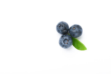 blueberry berries with green leaves isolated on white background