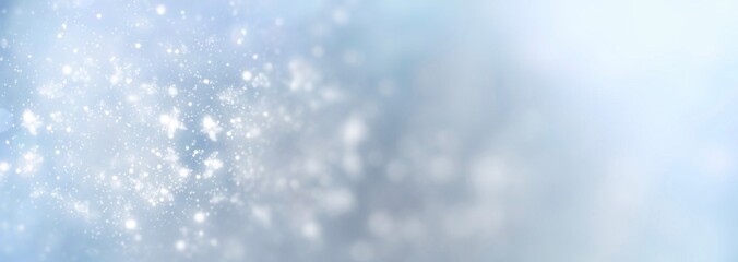 Fototapeta na wymiar White snowflakes on a blue background fall from the sky - Christmas and winter background banner