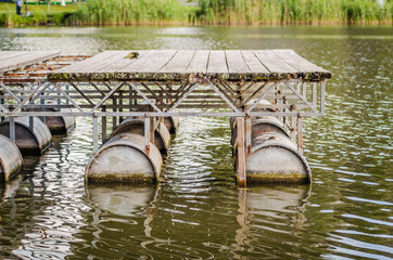 Improvised pontoon port on barrels on the Danube 