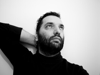 Close-up portrait of a handsome young man with brave manly face. Male beauty.