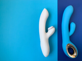 Sex toy. White Vibrator on a pink background