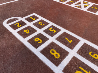 rubber coating of the playground, colorful bright markings, the concept of child safety in the playground