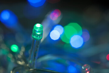 LED lights garland, colorful light bulbs on a bokeh background