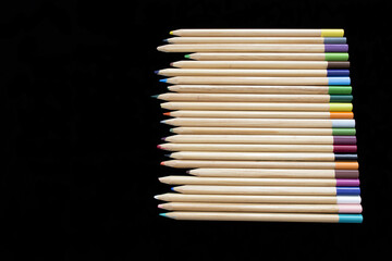 Fototapeta premium Set of pens of different pencils on black background.