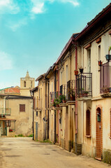 Fototapeta na wymiar View of a street with old facades in a small town in southern Italy