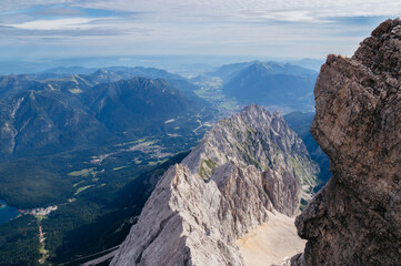 Fototapeta premium View over the Bavarian alps with a cloudy sky from the top of the Zugspitze mountain
