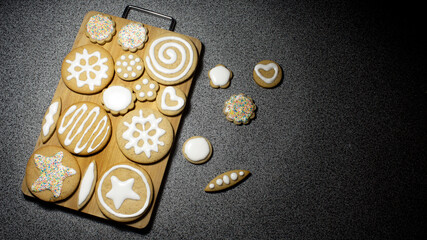 Christmas handmade cookies on the dark  surface top view / sweet baking background.