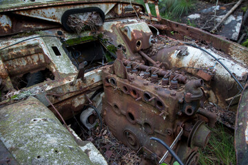 Old cars in Sscrapyard in forest in Ryd Sweden