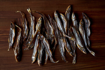 Dried smelt on a wooden table. 
