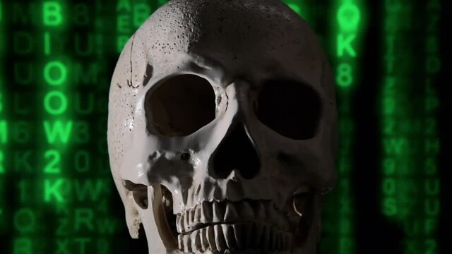 A scary human skull over a computer screen with falling green characters (matrix code rain effect), in the darkness.
