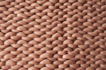 brown knitted fabric with large knitting needles