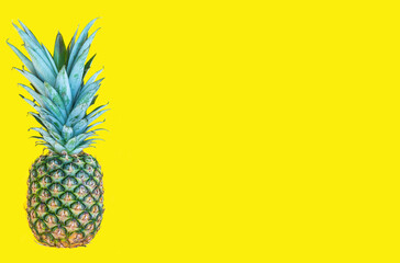 Pineapple on the yellow background. Healthy eating, fashion lifestyle concept. Summertime and holiday. Copy space