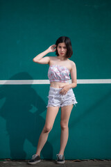 Portrait of hipsters girl pose for take a photo at tennis court,Thailand people,Lifestyle of modern thai woman