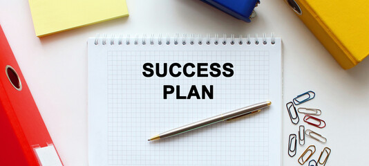 notebook with the inscription, calculator, pen lying on a white table