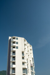 New home on a background of blue sky. The construction of apartments. The shore of the Black Sea.