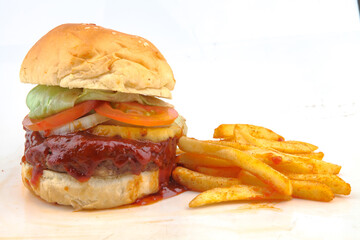 hamburger with beef, cheese and fried potato on a white background