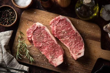  seasoned raw sirloin beef steak on cutting board © ahirao