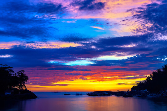 Sunset before an typhoon makes the sky explode with colors at Malandog beach on Panay island, Philippines