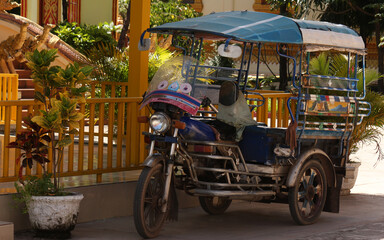 Tuktuk placed at a temple site in Siamese Lao PDR, Southeast Asia