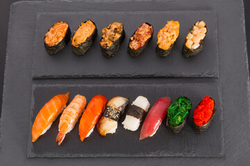 Baked sushi roll on dark background
