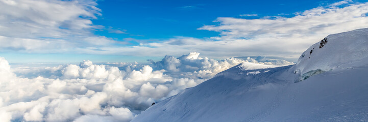 Blue sky background with tiny clouds in panoramic view. Mount Blanc.