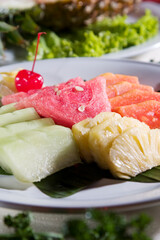 Fruit plating, slice of watermelon, melon, papaya, pineapple