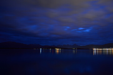 calm blue fjord and mountain and dawn
