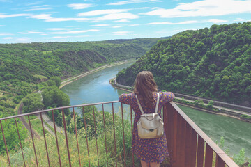 Beautiful mountain landscape with young woman enjoying wanderfull view