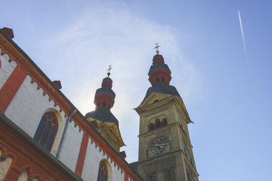 Church with old towers and air plane flying by