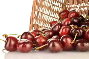 Ripe juicy organic sweet cherry, close-up, on a white background.