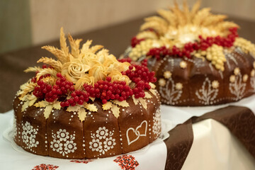 Two traditional wedding cakes. Wedding bread also known as Korovai  with decoration and snowball...