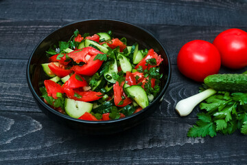 vegetable salad - tomatoes, cucmbers, parsley, onion. healthy and vegetarian food style