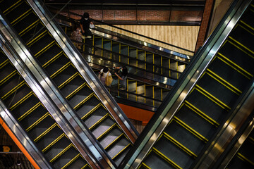 Masked people on escalators