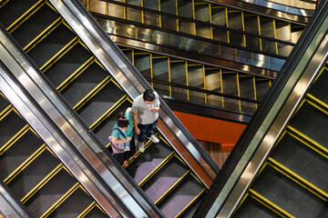 Masked people on escalators