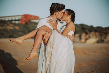 Wedding beach young couple sunset sand white happy sea waves