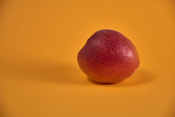Fresh juicy apricots in a transparent glass plate. Macro.